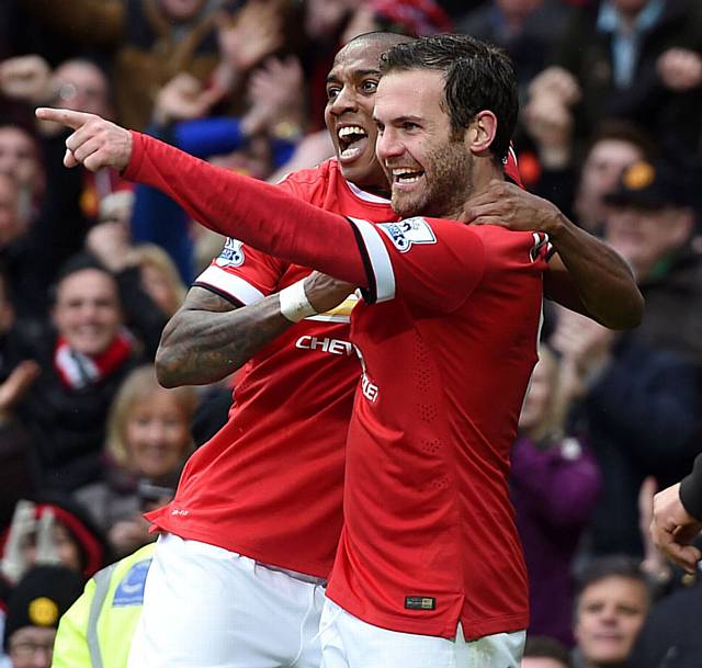HAPPIER TIMES . . . United’s Juan Mata (right) will miss the Champions League.