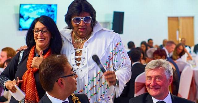 Asian-Elvis tribute Patelvis entertains at Asian Business Dinner, Eastern Pavilion, Oldham, May 2016. Pictured with outgoing Mayor of Oldham Councillor Ateeque Ur-Rehman and Interim Mayor Tony Lloyd
