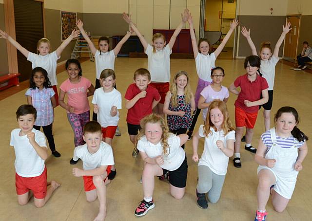Pupils from Medlock Vale and Holy Rosary RC primary schools rehearse at Medlock Vale for the Summer Bash, which will take place in Blackpool on May 29th, before the big Oldham Rugby League game. Various Oldham schools are involved.
