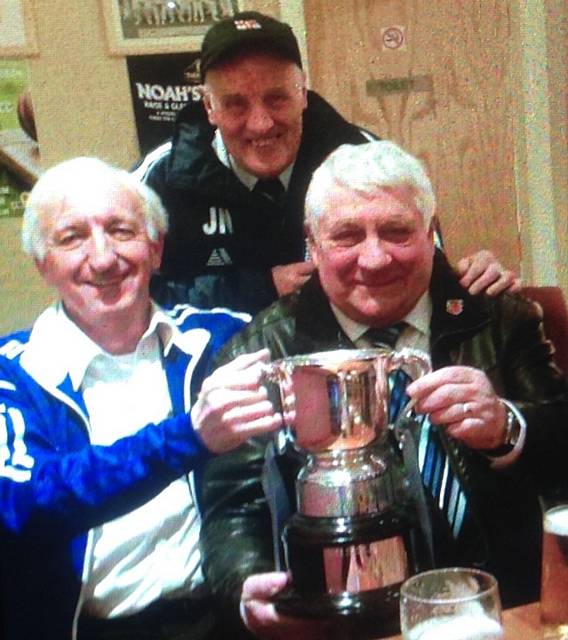 JOY BOYS . . . Heyside's Mick Cummins (left) and Mick Bloor with the Barlow Cup, as John Norbury looks on
