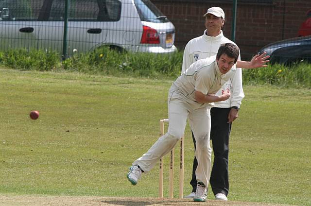 Umpire Craig Ramadhin looks on as Heyside skipper Ryan Barnes strives for a wicket against Austerlands in the Wood Cup