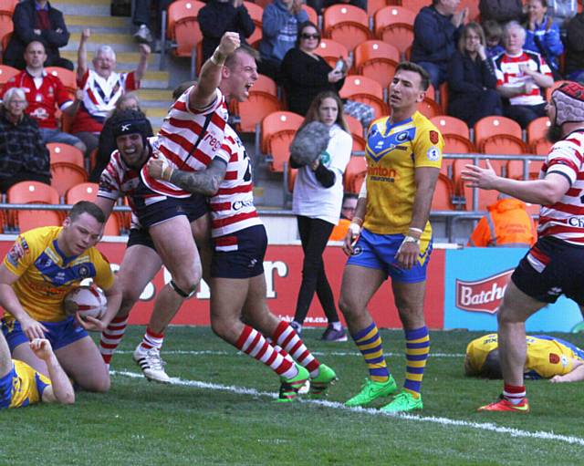 ADAM Clay celebrates scoring a late try ­- but it wasn't enough to squeeze Oldham home to victory on a day to forget in Blackpool     