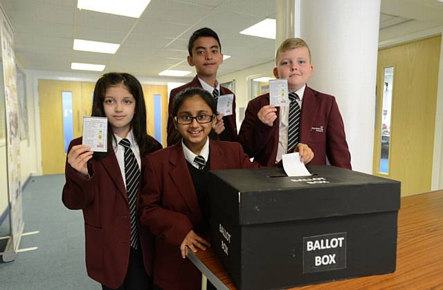 BOXING clever . . . .Hathershaw College pupils Arisha Imran, Khushi Patel, Syed Gillani and Thomas Hidderley cast their votes

