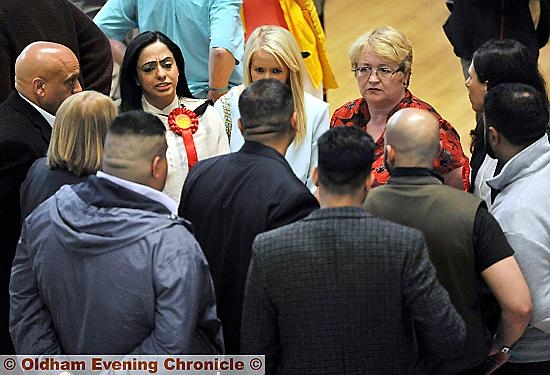 ANGUISH OF DEFEAT: Defeated Arooj Shah (top left) with supporters including Council Leader Jean Stretton