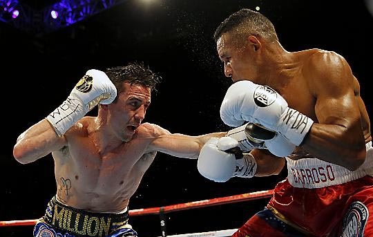 Anthony Crolla (left) and Ismael Barroso during the WBA World Lightweight Title bout at the Manchester Arena. 