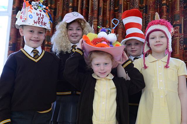HATS off to the fundraisers... Crazy Hat Day at St. Joseph's RC Primary School to raise money for Manchester Children's Hospital and Macmillan. Eva Clayton (8) pictured right with (L-R) Zach Bennett, Alex Buckley, Phoebe Kiernan and Ellie Hodson.