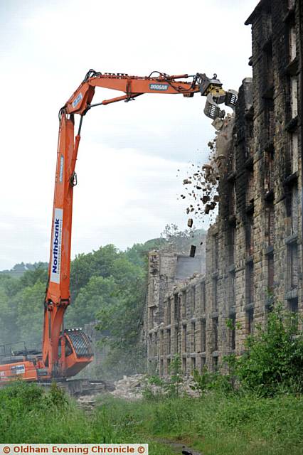 Bailey Mill being demolished after yesterday's fire.