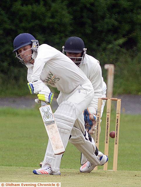 SHAW'S Tom Needham plays the ball off the front front in yesterday's Tanner Cup tie at Hollinwood. Shaw won on the toss of a coin after rain stopped play
