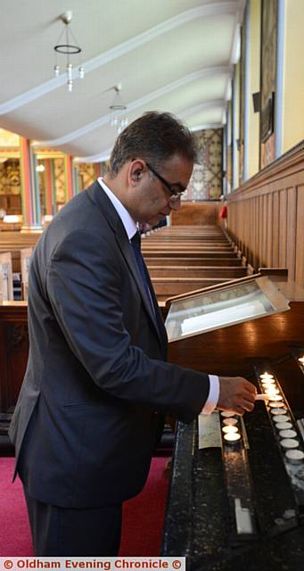 Prayers at Oldham Parish Church for murdered Labour MP Jo Cox. Pic shows Cllr. Ateeque Ur-Rehman lighting a candle.