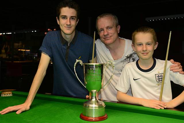 SO PROUD . . . champions Aaron Davies (left) and brother Ryan, with dad Martin
