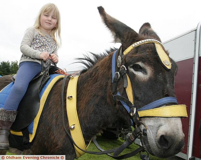 CHARLOTTE Thomas (5) enjoying the donkey ride