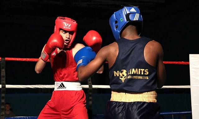TOE-TO-TOE . . . Oldham's Nenny Hussain stays focused on his way to a points victory