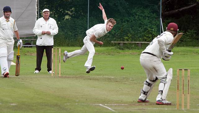MOORSIDE'S Jamie Taylor in delivery stride against Brian Lord, of Saddleworth, in the Wood Cup