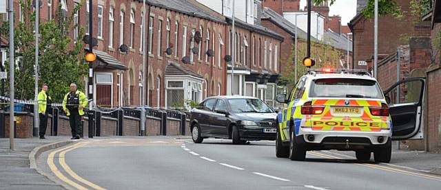 Park Road, Oldham closed off around 6.45pm as police investigate incident on crossing near junction of Hardy Street.
