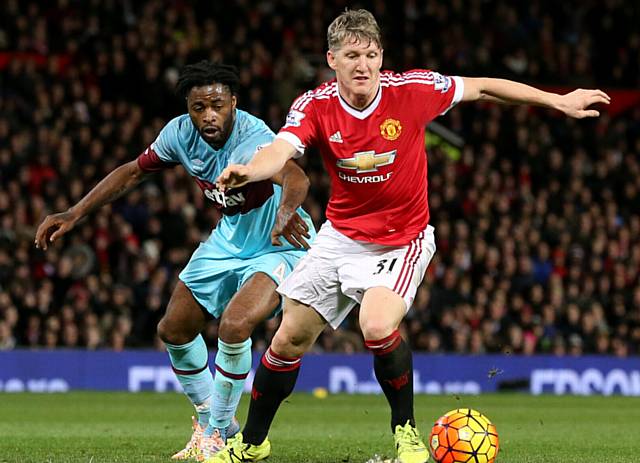 Manchester United's Bastian Schweinsteiger and West Ham United's Alex Song (left) battle for the ball during the Barclays Premier League match at Old Trafford, Manchester..
