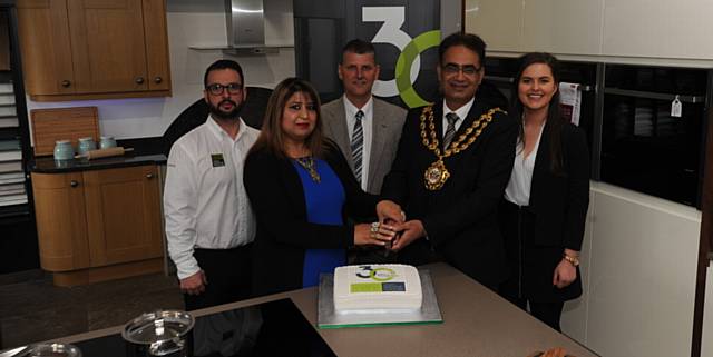 LET'S celebrate . . . Neil Myers, installation manager; Yasmin Toor, former mayoress; Mike Jackson, managing director; Councillor Ateeque Ur-Rehman; and Mica Wood, marketing assistant