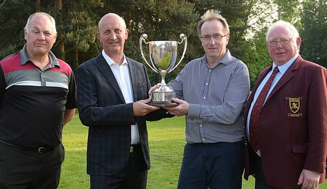 ALL YOURS . . . winner Les Dooley (second right) receives the Chronicle Cup from managing editor Dave Whaley. Also pictured is runner-up Dave Pullen (left) and Werneth captain John Mellors