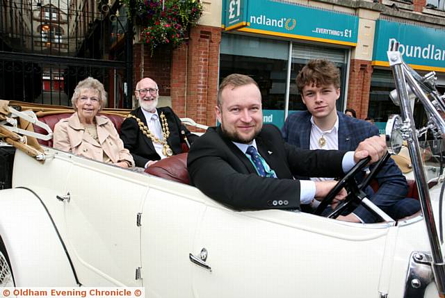 TRAVELLING in style . . . the Mayoress and Mayor of Oldham, Di and Derek Heffernan, sitting in the back of a 20-25 Rolls Royce, that once belonged to the Singer sewing machine company. Sitting in the front is the Mayor's attendant Konrad Zielinski, along with the Youth Mayor, T. Jay Turner
