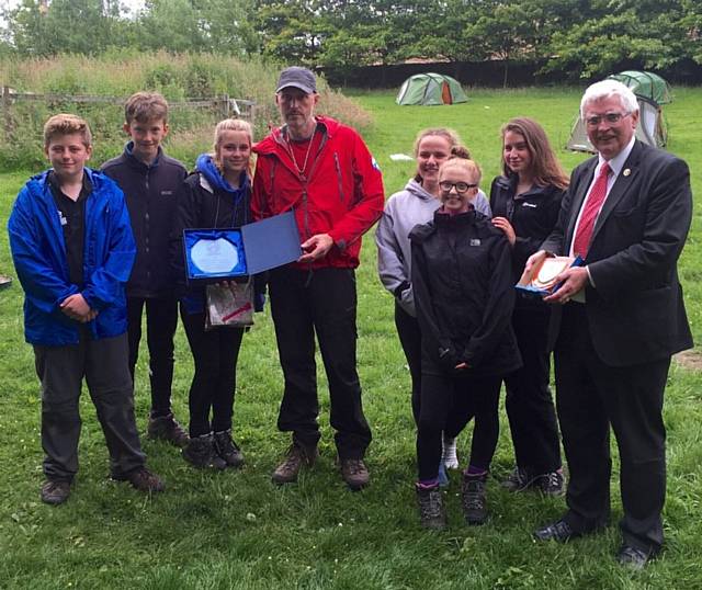 PICTURED are Oldham Mountain Rescue Team leader Mick Nield (on the left) and Jim Upton, senior deputy head teacher at Crompton House School, with pupils.
