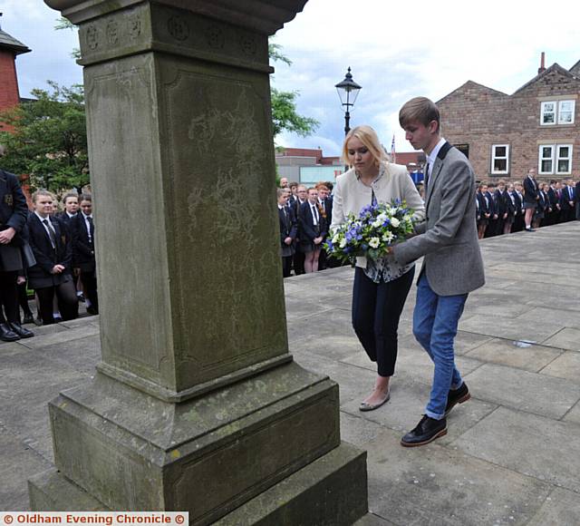HONOUR . . . Megan Ames and Mitchell Scott, last year's head boy and head girl lay a wreath