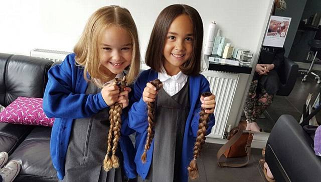 WE did it...twins Georgina and Arielle had their hair cut for the Little Princess Trust