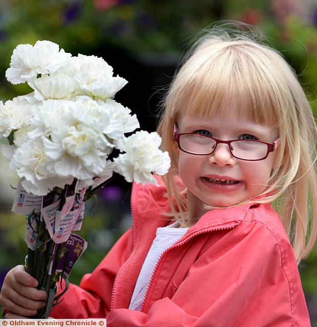 LECKSI Butler (5) is all smiles with flowers