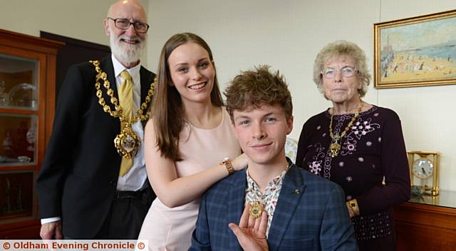 BADGE of pride . . . new Youth Mayor T Jay Turner replaces last year's Youth Mayor Saskia Edwards, pictured with the Mayor Councillor Derek Heffernan and Mayoress Di Heffernan