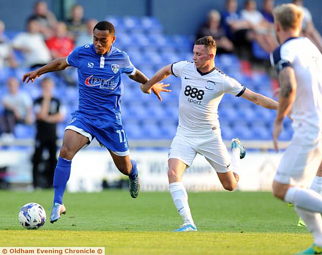 ON THE CHARGE . . . Athletic youngster Kallum Mantack tries to hold off a challenge from a Preston defender
