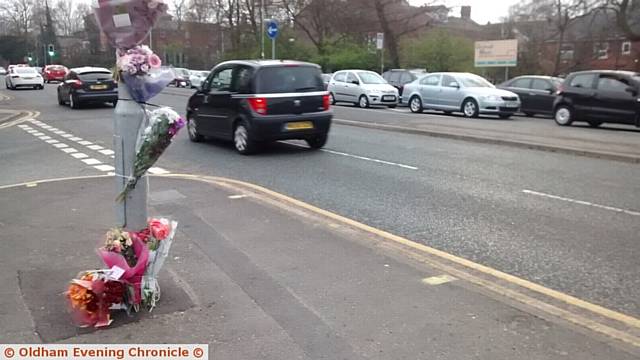FLOWERS at the scene of the fatal collision