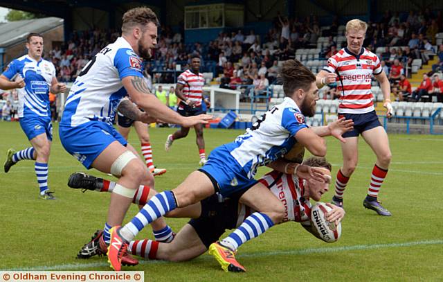 DIVING OVER . . . Full-back Richard Lepori scores Oldham's first try
