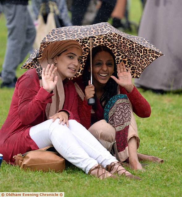 Even the rain did not dampen the crowds . . . Salma Farooq, left, and Iqra Sabar