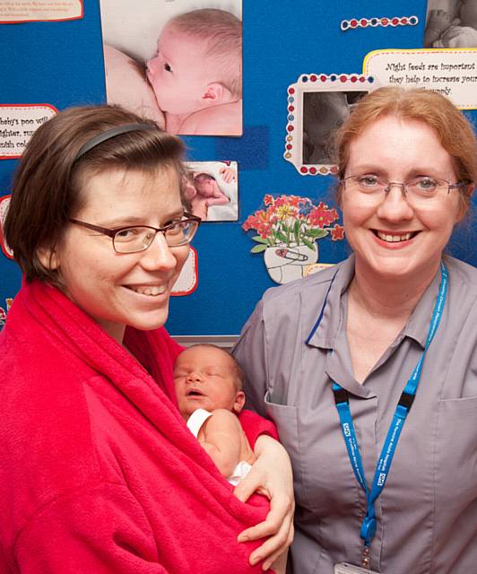 New mum Maria Banel with baby Piotr gets some sound advice from infant feeding adviser midwife Michele Ogden