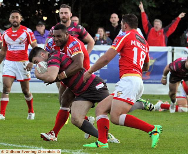 NO STOPPING ME . . . Liam Thompson shows grit and determination to notch the Roughyeds' third try 