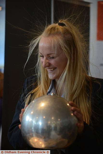 The Big Bang science event at the Regional Science Centre for local schools, organised by Oldham Sixth Form College and Oldham Business Leadership Group. Ella Caine (14) from Blue Coat School feels the full effect of the Van de Graaff Generator.