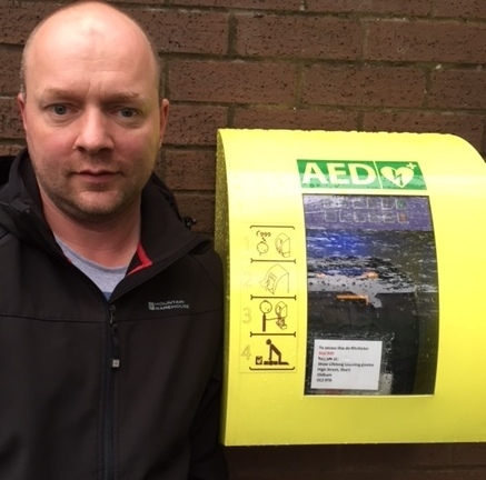 ANGRY . . . Councillor Dave Murphy with vandalised defibrillator in Shaw