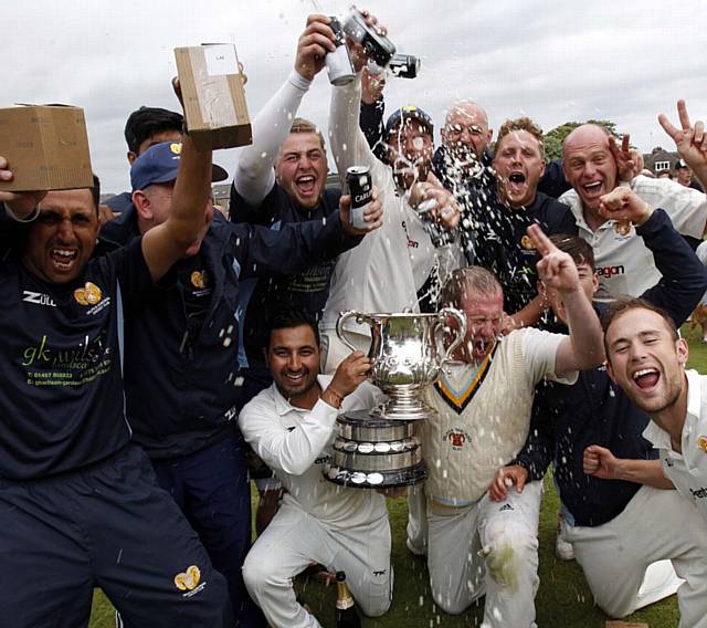 WHAT A CELEBRATION . . . Delph players lap up their Sykes Cup victory
PICTURE courtesy of THE HUDDERSFIELD EXAMINER