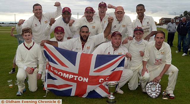 FLYING THE FLAG . . . Crompton celebrate Tanner Cup final success