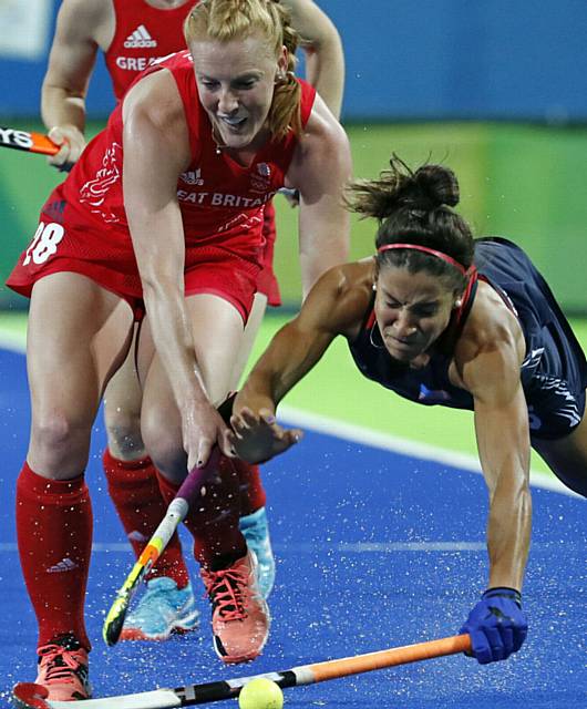 Nicola White sends a United States player crashing to the ground in the group stages