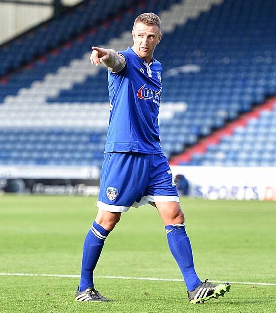 POINTING THE WAY . . . Peter Clarke was handed the captain's armband for his debut against Preston