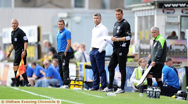 ATHLETIC boss Stephen Robinson (white shirt) and Ian Baraclough (right) watch events unfold