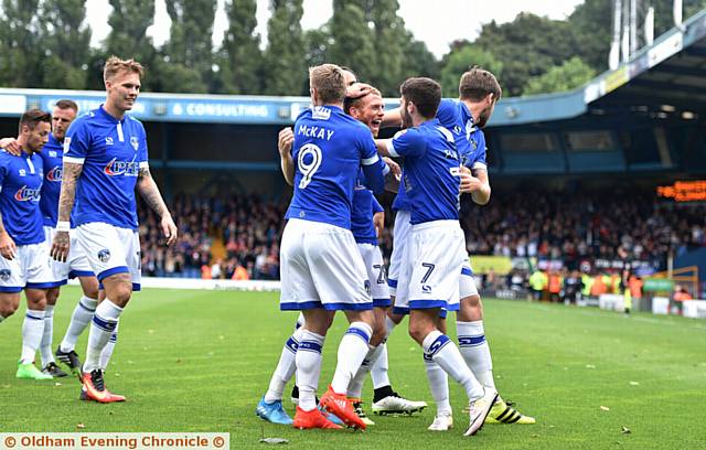 HAPPY DAYS . . . Athletic's Lee Erwin (third left) heads to join in the goal celebrations at Gigg Lane on Saturday