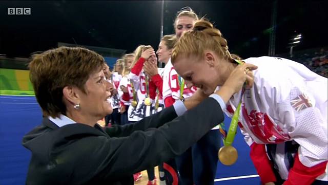Nicola White is presented with gold medal in Rio Olympic hockey final 2016. PIC from BBC TV.