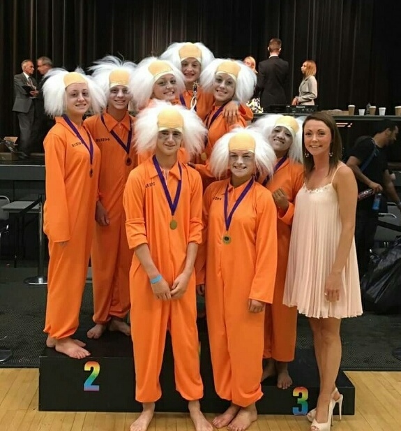 Illusion U18's team Mad Criminals from Pure Dance Academy in Derker with principal teacher Rebecca Jarvis.