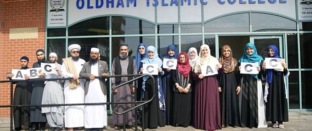 Pupils and staff celebrate the first A-level resuts at Oldham Islamic College, Union Street. Pictured from left are Aminul Islam, Kamal Uddin, Suhaid Ahmed, vice principal Zahoor Ahmed Chisty, principal Mowlana Nazmul Hussain, CEO Dr Abdul Mueed, trustee Jean Weston, Khadija Muslim, Morriom Muslim, college manger Zuhra Taybeah, trustee Aysha Islam, Fathema Muslim, Anam Haque, Afia Muslim and Rishma Akhter.