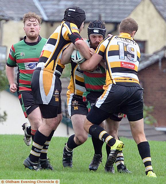 ON THE CHARGE . . . Waterhead's Michael Bennett tries to breach the Drighlington defence
