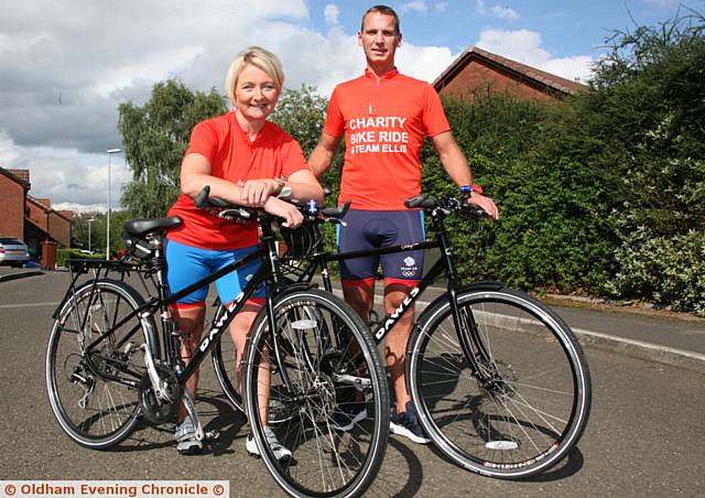 MARATHON ride . . . Julia and Graham Cooper are cycling from Royton to Barcelona for Ellis, right
