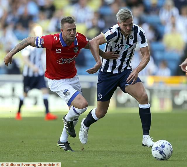 TUSSLE . . . Millwall's Steve Morison (right) tussles for the ball with Athletic skipper Peter Clarke. 