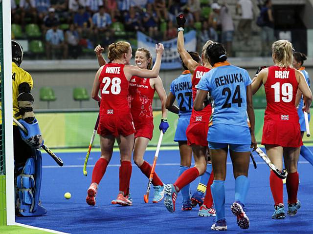 GET IN . . . Oldham's Nicola White (number 28) celebrates after scoring against India in Rio