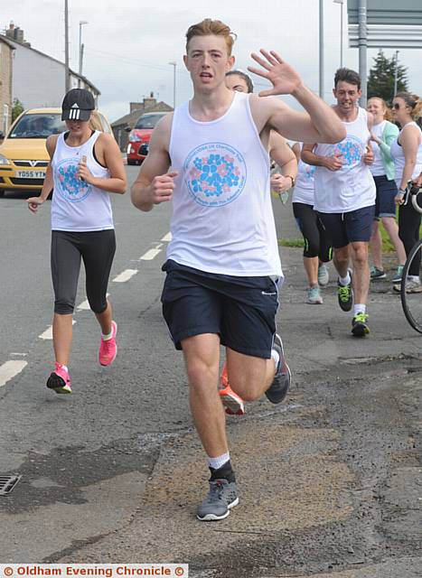 RUNNING man . . . Jake en route from Halifax to Oldham