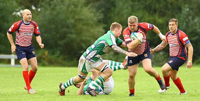 ON THE ATTACK . . . Oldham's Gareth Blomeley carries the ball forward against Wigton. 